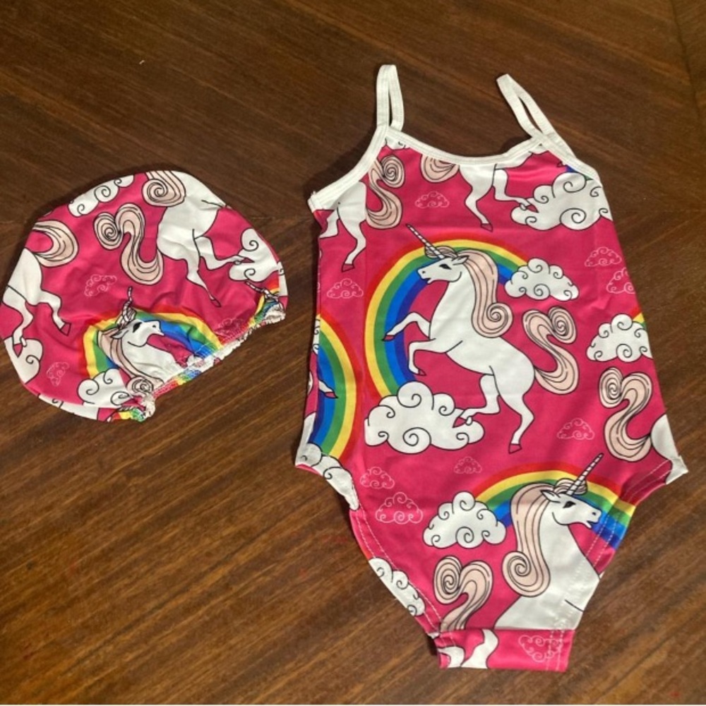 Unicorn Pink Kids Swim One Piece with cap.
Brand New